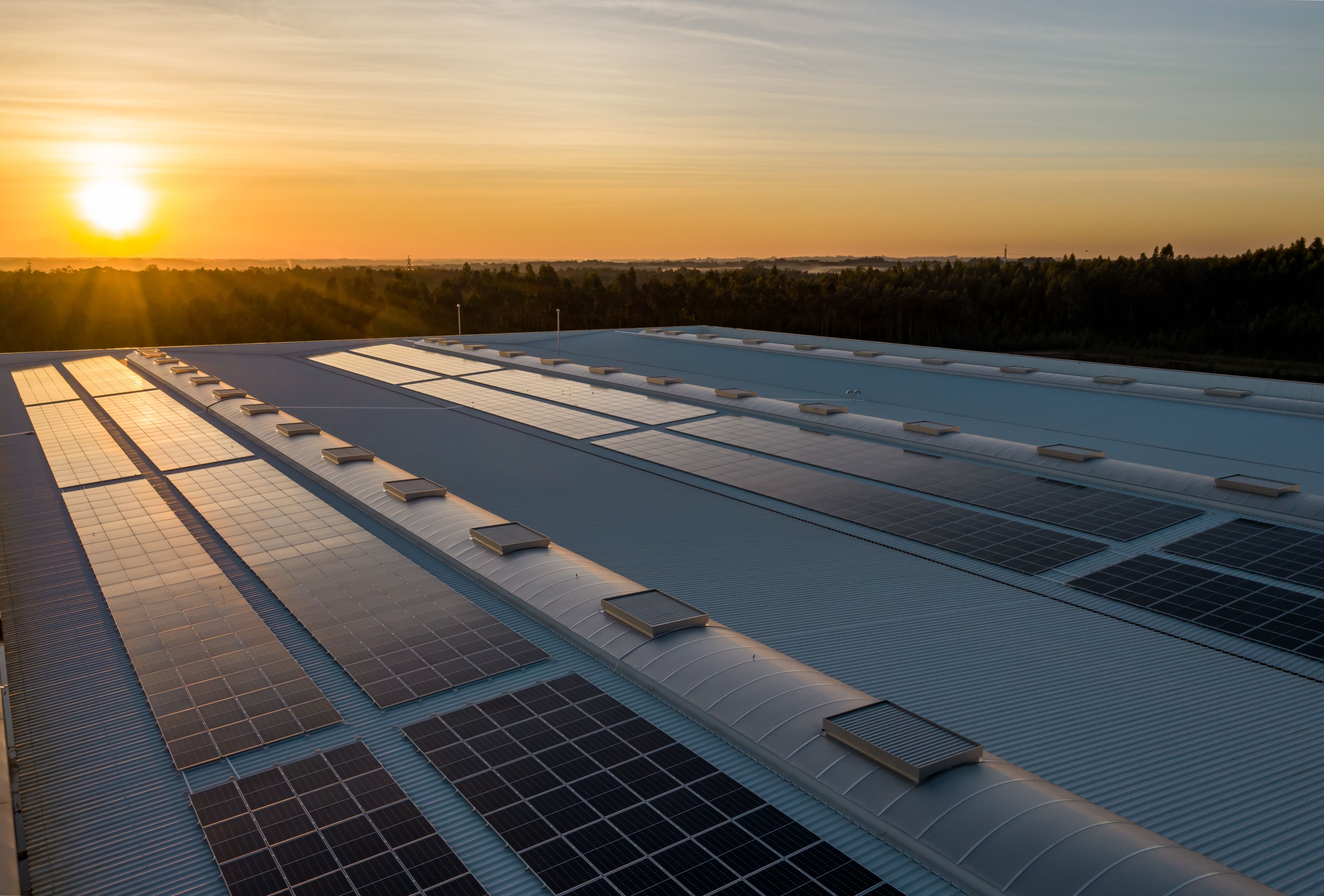 Solar panels on a roof at sunset