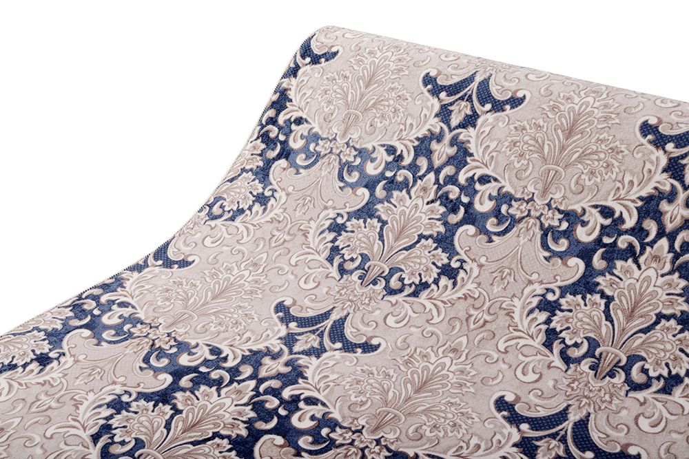 Blue and cream carpet with a modified fleur-de-lis pattern