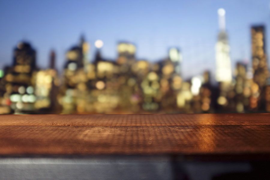 Wooden deck with a city skyline in the background